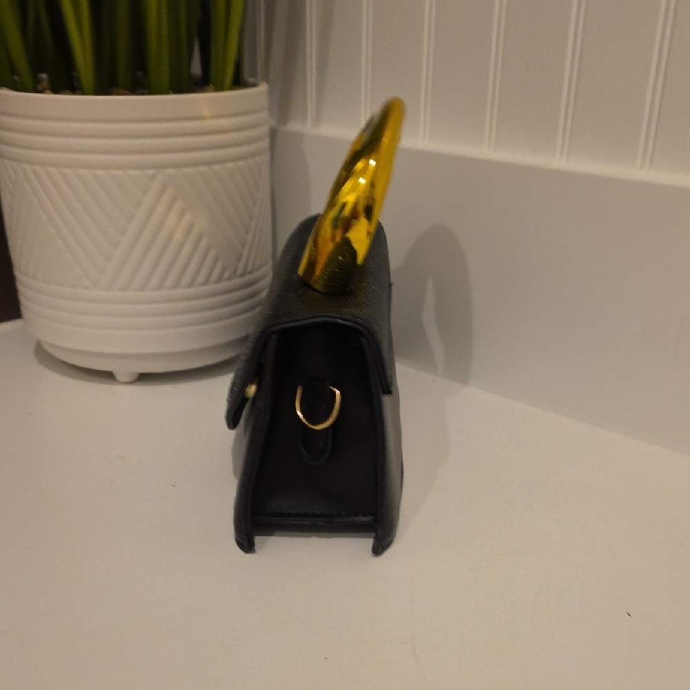 25. Elegant Black Clutch with Gold Handle - Picture 3 of 6